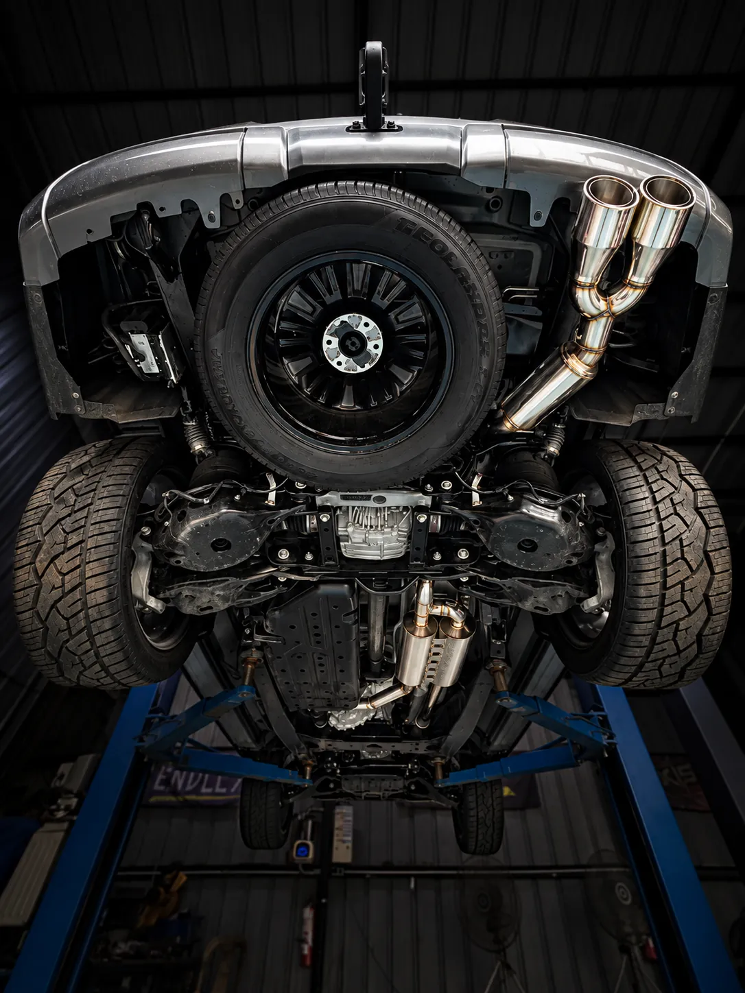 Full exhaust with two custom headers merging into a single exit on a gasoline car