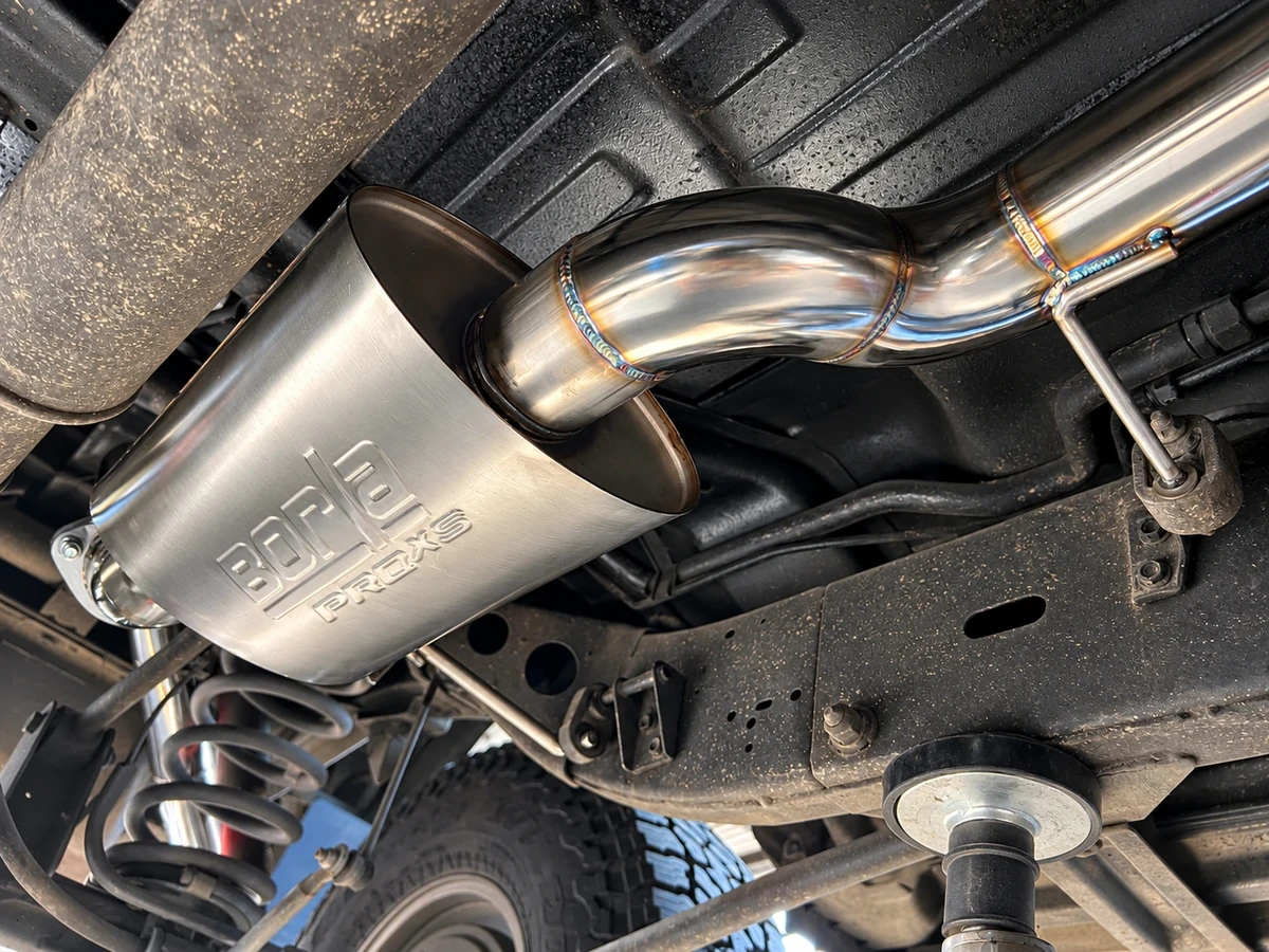 Borla Pro-XS muffler with its embossed logo, installed under a truck