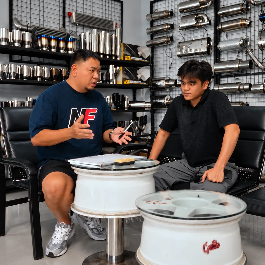 Kuya Ron explaining options to a customer in the Nitrofuze showroom